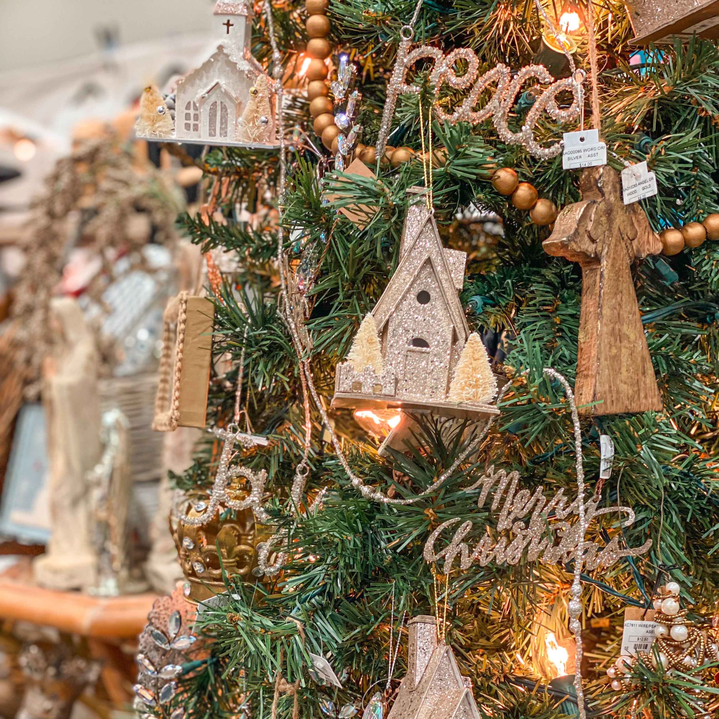 Decorative Christmas tree with wooden ornaments and fairy lights